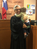 Children's Court Judge hugging child